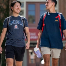 Two students walking together on campus