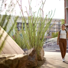 Student walking by admin building