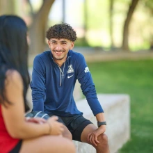 Two students talking outside