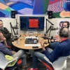 people sitting in front of podcast equipment