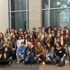 group of students in front of window