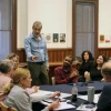Dean Pollard speaking to room of people