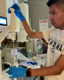 student working with lab equipment